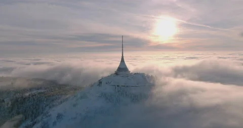 Jested tower mountain hill with snow mist and fog at golden hour Stock Footage 231577496