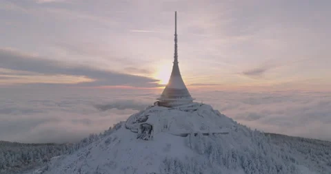 Jested tower mountain hill with snow mist and fog at golden hour Stock Footage 231579783