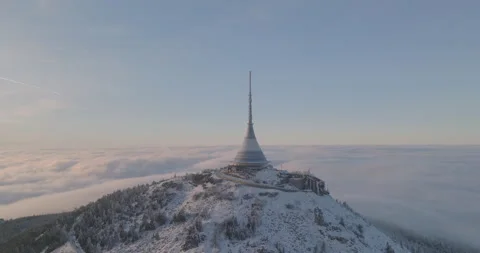 Jested tower mountain hill with snow mist and fog at golden hour Stock Footage 231579806