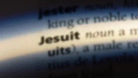 Jesuit word in a dictionary. Stock Footage 99561702