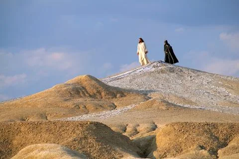 Jesus and Devil on a hill in a desert Stock Photos