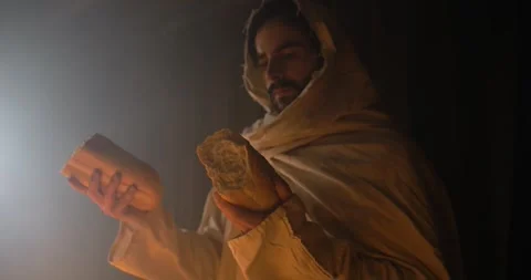 Jesus Christ in Ambient Light Holding Passover Bread, Christianity, Bible Stock Footage 318430375