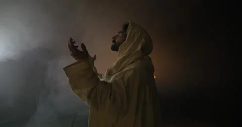 Jesus Christ in Ambient Light Praying Stock Footage 318436488