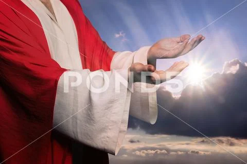 Jesus Christ reaching out his hands and praying against blue sky Stock ...