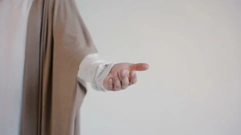Jesus hand in a robe on a white background. Studio 스톡 동영상 160493654