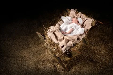 Jesus Laying on a Manger Stock Photos