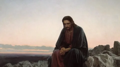 Jesus Sits Somberly Contemplating Stock Footage 139012057