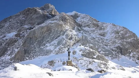 Jesus on the summit of mountain. Snow and ice Stock Footage 239340733
