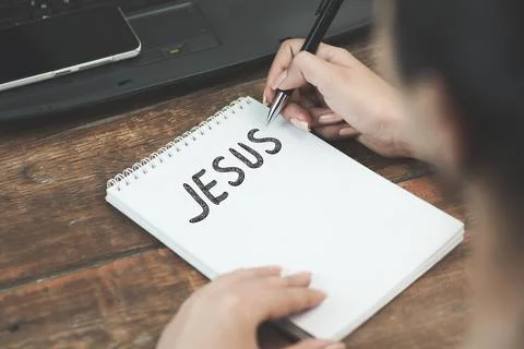 Jesus text on notebook Stock Photos