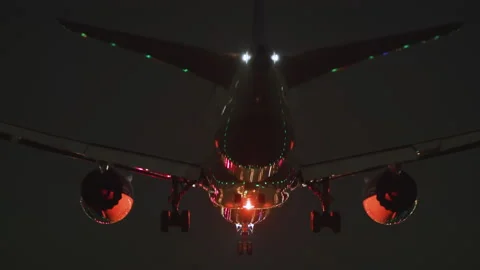 Jet air plane landing at Night. Transportation, flights and travel concepts. Stock Footage 155423599
