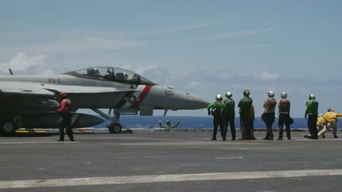 Jet aircraft taking off from deck of the USS Carl Vinson Stock Footage 117717626