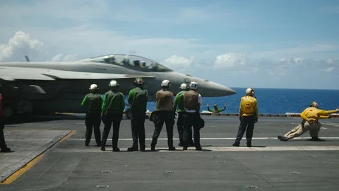 Jet aircraft taking off from deck of the USS Carl Vinson Stock Footage 117717731