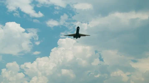 Jet Airliner on Final Approach from Below with Epic Clouds Stock Footage 41176804