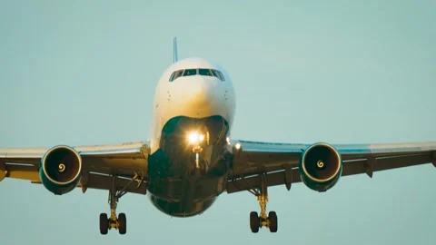 Jet Airliner Front View. Twin engine passenger aircraft approaching runway with Stock Footage 345501057