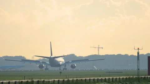 Jet airplane arriving at sunset Stock Footage 317050175