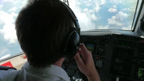 Jet Airplane Pilot in the Cockpit, Still and then Pans Left Stock Footage