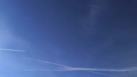 Jet airplane on sky blue. A long trail. Chemtrails Stock Footage 150953333