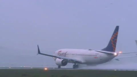 Jet Batik Air Malaysia take off during downpour Stock Footage 312424970