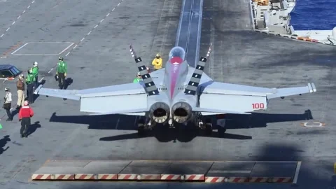 Jet blast deflector lifting prior to F/A-18 Hornet launching from USS Nimitz Видео 228947433