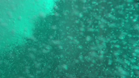 Jet of blue clear water with bubbles Stock Footage 88433845