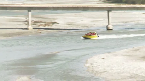 Jet boat coming up river Stock Footage 5503299