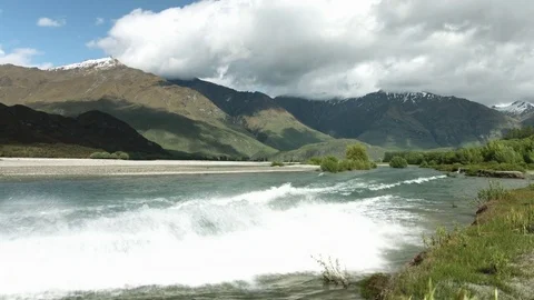 Jet boat drive by cold alpine river Stock Footage 82676101