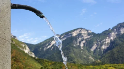 Jet Of Clean Drinkable Water Is Coming Out Of A Pipe In Mountain Spring. Stock Footage 92308341