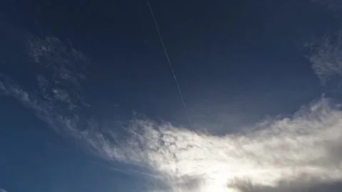 Jet Contrail Through Clouds Stock Footage 251606624