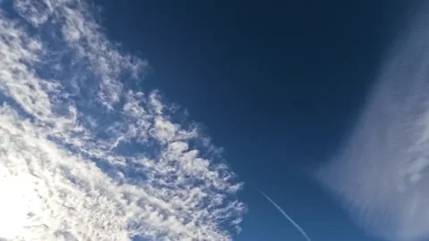 Jet Contrail Through Clouds Stock Footage 261340418
