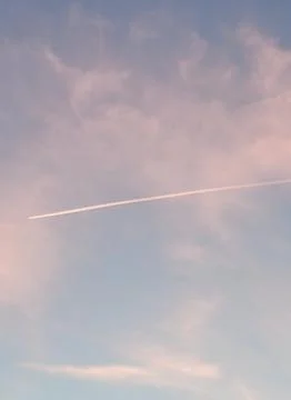 Jet Contrails in the Sky Stock Photos
