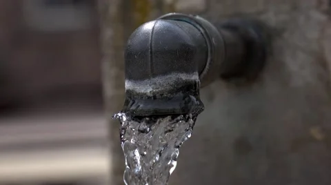 The jet of drinking water from the spring crane Stock Footage 65495884