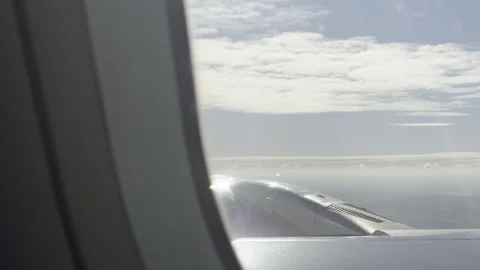 Jet engine above white clouds 4K Stockbeeldmateriaal 333664276