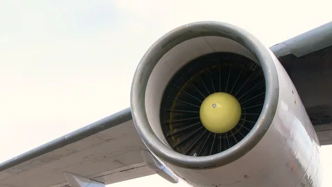 Jet engine of an airliner plane still in function rotating while the plane is pa Stock Footage 128633080