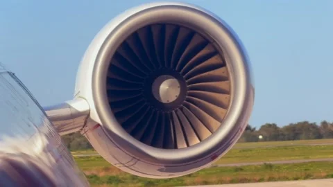 Jet Engine Blades Spinning During Startup. External Front View in a Sunny Day Stock Footage 328997395