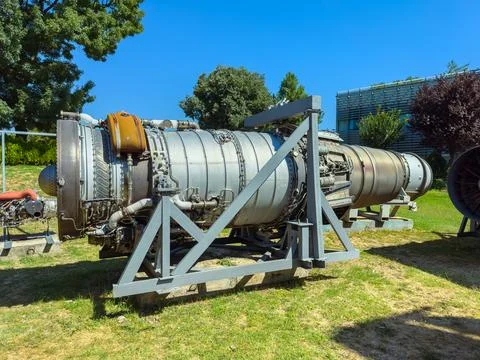 Jet engine on display at a technology museum during daylight Stock Photos