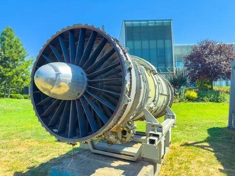 Jet engine displayed outdoors at a museum on a sunny day Stock Photos