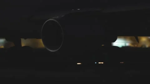 Jet engine intake close-up at night with airport lights 库存影片 334345330