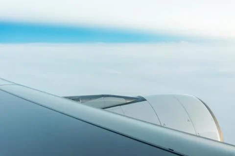 Jet engine on Plane wing Stock Photos