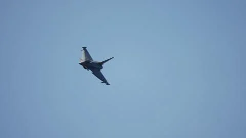 Jet fighter approaching camera in slow motion bank Stock Photos
