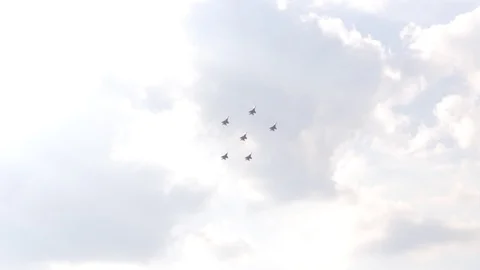 A jet fighter makes a figure "Barrel Snap Aileron Roll" at an air show. A group Video stock 125266972