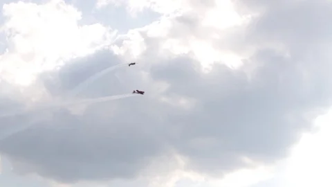 A jet fighter makes a figure "Barrel Snap Aileron Roll" at an air show. A group Video stock 125271353