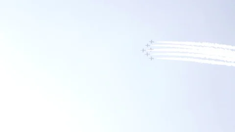 A jet fighter makes a figure "Barrel Snap Aileron Roll" at an air show. A group Stock Footage 125285194