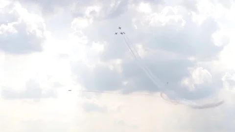 A jet fighter makes a figure "Barrel Snap Aileron Roll" at an air show. A group Stock Footage 125285853