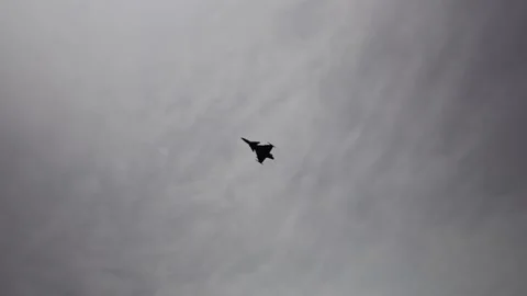 Jet fighter Saab JAS 39 Gripen performs sharp turn against overcast sky showing  Stock Footage 311662231