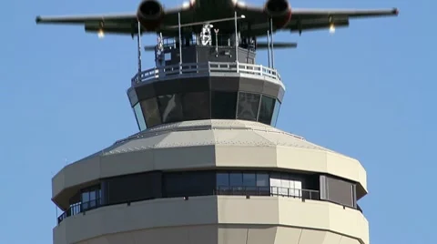 Jet Flies Over Airport Control (radar) Tower for Air Traffic Control Stock Footage