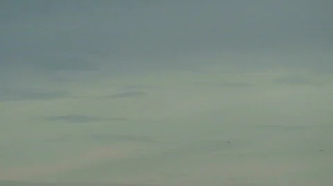 Jet flies through frame in distance Stock Footage 112623