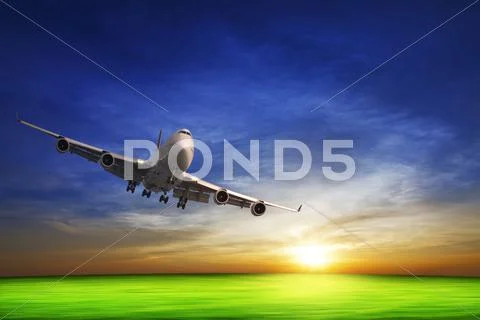 Jet in flight and sunset sky Stock Photos