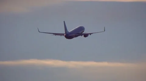 Jet flying into sunset Stock Footage 45886405