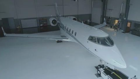 Jet In Hanger Attached To Pushback Tractor 스톡 동영상 208714675