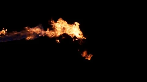 Jet of hot flame sprayed in from left of frame Stock Footage 77134399